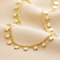 Tiny Star Charm Necklace in Gold